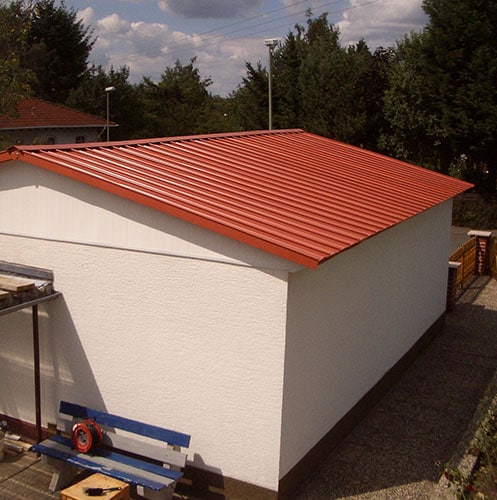 Roofing_sheet_plastic_brick_red_on_hall_roof